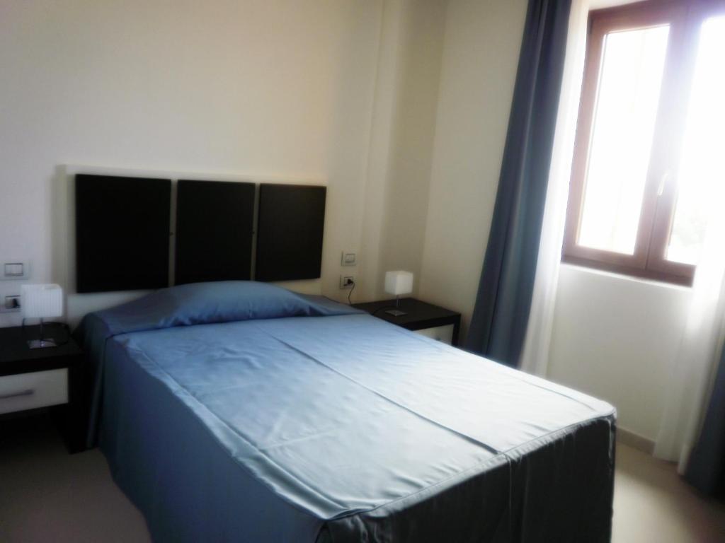 Buddi Hotel Platamona Pokoj fotografie