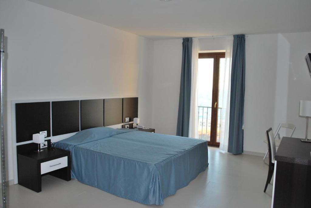 Buddi Hotel Platamona Pokoj fotografie