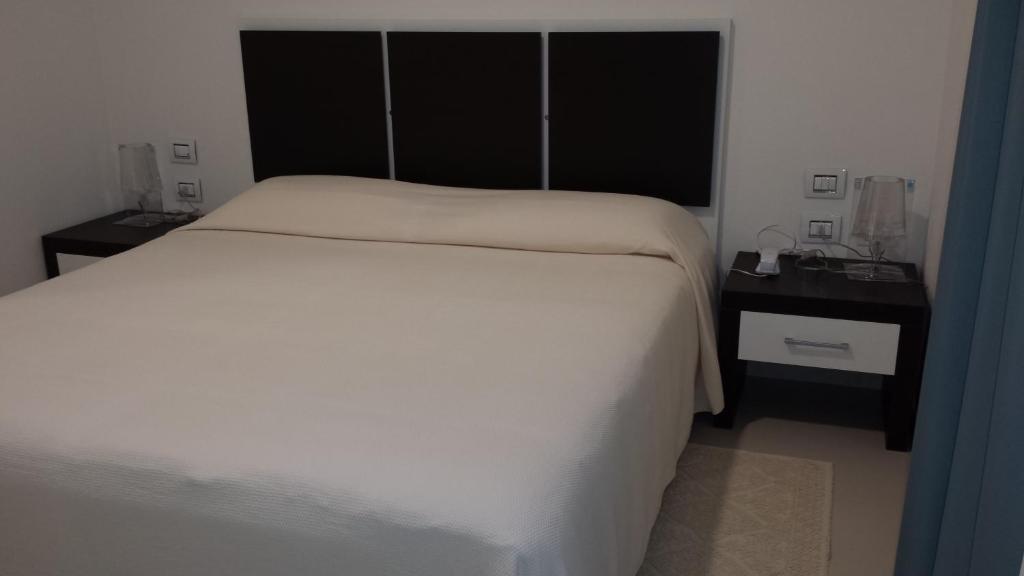 Buddi Hotel Platamona Pokoj fotografie